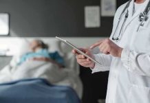 Pope Leo Waits on CANCER Test After Surgery Doctor using tablet beside hospital patient