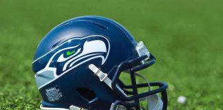 American football helmet on grass